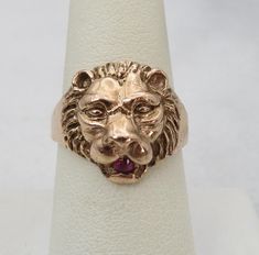 Estate antique 14k rose gold ring lion face ruby in mouth. unique lion face ring size 8.5. nice pre-owned condition. 5 grams. 16mm wide. one 3mm natual ruby.  unmarked acid tests for 14k. will come in nice ring box. Lannister Fashion, House Lannister, Face Ring, Lion Ring, Lion Face, 14k Rose Gold Ring, Ring Box, Rings Statement, Rose Gold Ring