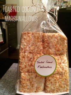 toasted coconut marshmallows in a bag on a table with text overlay that reads toasted coconut marshmallows