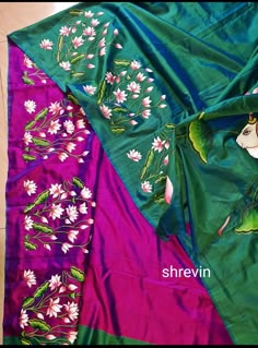 two different colored silks with flowers on them, one is green and the other is pink