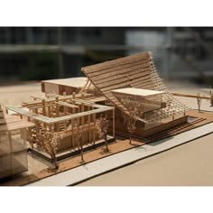 an architectural model of a house in the middle of a desert with trees and buildings around it