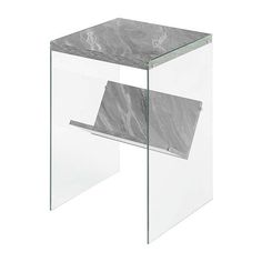 a glass and marble side table with one section cut out to show the top part