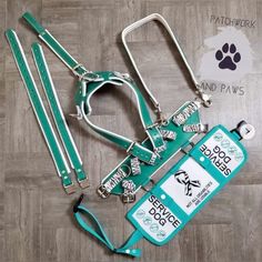 the dog leash and collar are laid out on the floor with their tags attached to them