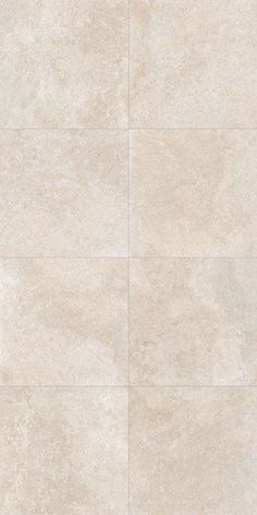 a white tile floor with different shades of beiges and whitese on the tiles