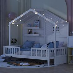 a white bed with lights on top of it