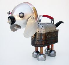 a metal robot with a helmet on it's head