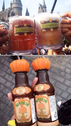 two bottles of pumpkin juice are being held in front of a castle and one is filled with liquid