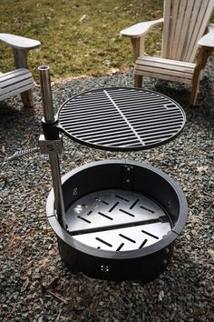 an outdoor fire pit on gravel with chairs around it and a grill in the middle