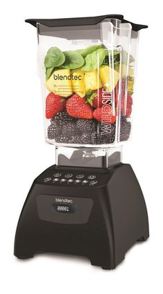 a blender filled with fruits and vegetables