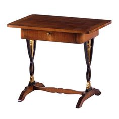 a small wooden table with two legs and a drawer on the top, against a white background