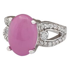 Stamped: 14K White Gold Total Ring Weight: 8.8 Grams Ring Length: N/ARing Width: N/A Gemstone Weight: Total Natural Jade Weight is 6.55 Carat (Measures: 14.00x10.10 mm) Color: Pink Diamond Weight: Total Natural Diamond Weight is 0.70 Carat Quantity: 30 Color: F-G, Clarity: VS2-SI1 Face Measures: 14.00x10.10 mm Sku: [704128W] Formal Ruby Ring With Oval Cabochon Center Stone, Formal Ruby Ring With Oval Cabochon, Heirloom White Gold Ring With Oval Cabochon, Heirloom White Gold Oval Cabochon Ring, Oval Art Deco Rings For Formal Occasions, Art Deco Oval Rings For Formal Occasions, Formal Oval Cabochon Diamond Ring, Formal Fine Jewelry Ring With Cabochon, Formal Art Deco Oval Rings