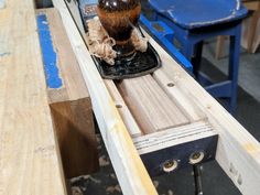 a piece of wood being worked on with a grinder