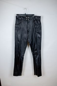 For sale is a pair of vintage leather pants.  Tagged size 34, see measurements Measurements laid flat: Inseam length: 32" Outseam (total) length: 43" Waist width: 17" Thigh width: 12" Rise height: 12.5" Leg opening width: 7.5" Vintage Leather Pants, Leather Motorcycle Pants, Motorcycle Pants, Mens Trousers, Vintage Leather, Favorite Outfit, Leather Pants, Made In Usa, Black Leather