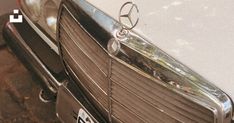 the front end of an old mercedes car with its hood ornament hanging from it