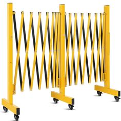 three yellow and black barricades with wheels on each side against a white background