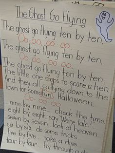 a child's hand holding up a sign that says, the ghost go flying