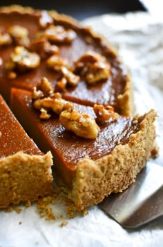 a close up of a pie on a piece of paper with a slice cut out