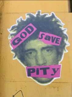 a sticker on the side of a building that says god save pity