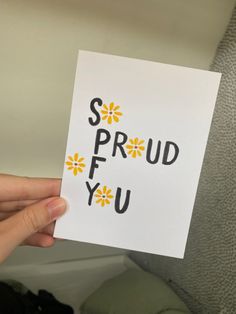 someone holding up a card with the words sprudf you on it in black and yellow