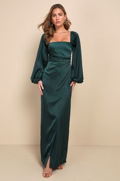 Romance is sure to follow a gown as glorious as the Lulus Eternal Heart Emerald Green Satin Long Sleeve Maxi Dress! Sleek woven satin creates a sophisticated square neckline, a darted bodice, and long balloon sleeves with elastic at the shoulders and cuffs. High fitted waist, with a bit of gathering, sits atop a tulip-style maxi skirt with an alluring side slit. Hidden back zipper/clasp. Fit: This garment runs large - please size down. Length: Floor length. Size medium measures 53" from shoulder Long Sleeve Teal Bridesmaid Dresses, Long Dress Emerald, Bridesmaid Gown Ideas With Sleeves, Winter Bridesmaid Dresses Emerald Green, Bridesmaids With Sleeves, Emerald Green Silk Dress Long Sleeve, Satin Emerald Dress, Prom Dresses Emerald Green Long Sleeve, Long Sleeve Floor Length Dress Formal Gowns