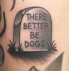 there is a tattoo on the back of a man's arm that says, there better be dogs