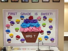 a classroom display with cupcakes on the wall