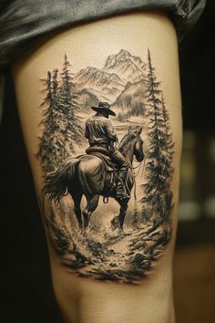 Cowboy on horseback in a forest with mountains in the background, tattooed on a person's leg. Cowboy Arm Tattoos, Men Country Tattoos, Rancher Tattoo Ideas, Whitetail Deer Tattoo, Horse Back Tattoo, Black German Shepherd Tattoo, Western Horse Tattoos For Women, Windmill Tattoo Design, Wilderness Tattoo Sleeve