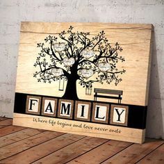 a wooden sign that says family with a tree and bench in the center on it