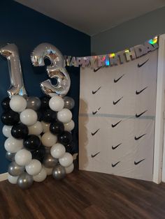 Black-and-white balloon towers Nike backdrop Nike Bday Party Ideas, Boy 13th Birthday Ideas, 14th Birthday Party Ideas For Boys, 13th Birthday Party Ideas For Boys, Dollar Tree Birthday, Golden Birthday Gifts, 13th Birthday Boys, 14th Birthday Party Ideas