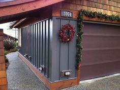 a garage with a wreath on the door