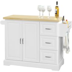 a white kitchen island with two wine glasses on top