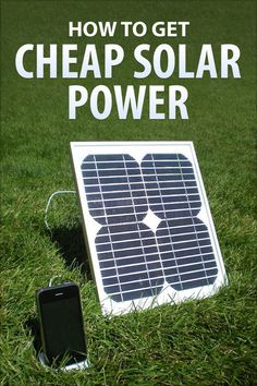 a solar panel sitting in the grass next to a trash can and an electrical outlet