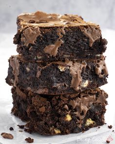 three chocolate brownies stacked on top of each other