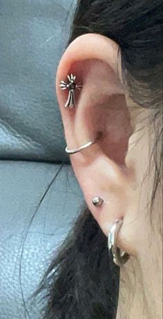 a woman with ear piercings on her ears