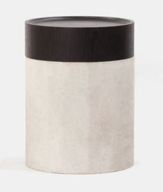 a black and white vase sitting on top of a table