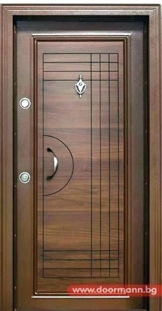 the front door is made from wood and has a metal handle