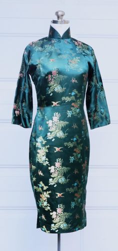 Vintage 60's Chinese custom made long sleeve silk QiPao dress color green, In good vintage condition, Some light stains on the collar ( inside ). It' 100% silk. Weighs 11 Oz. ( the owner used living in Taiwan back 60'sto 70's. ) Thanks. Ship US only I'll add more pictures soon. Collar 14" Fits like: M ? Shoulder: 15" Bust: 33" Waist: 28" Hips: 34" Full Length: 42" Green Long Sleeve Formal Dress For Spring, Spring Green Long Sleeve Formal Dress, Green Long Sleeve Dress For Spring Formal, Fitted Silk Long Sleeve Dress For Spring, Green Long Sleeve Lined Dress, Formal Green Fitted Long Sleeve Dress, Green Fitted Long Sleeve Dress For Formal Occasions, Dark Green Fitted Long Sleeve Dress, Green Ao Dai For Spring Party