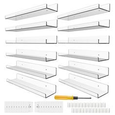 a set of white shelves with various tools and rulers on the top one is empty