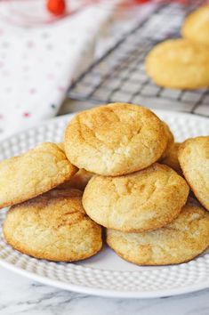 a white plate topped with cookies on top of a table