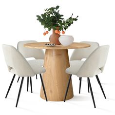 a round table with four chairs around it and a potted plant on the top