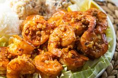 a plate filled with shrimp and rice on top of a table