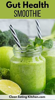 green smoothie in a mason jar with two straws