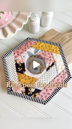 the video is showing how to make a quilted patchwork coaster with an applique