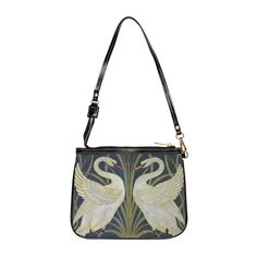 "Made with high-grade vegan leather, this unique shoulder bag adds a chic touch to any outfit. Its compact size (10\"w x 8\"h) and lightweight construction makes it the perfect accessory for carrying your essentials in striking style. Our Swan and Iris shoulder bag features stylized swans and irises from an 1875 dado wallpaper design by English painter and illustrator, Walter Crane (1845-1915). This design is evocative of ancient Egyptian imagery, while also peering into the future with a subtle but unmistakable foreshadowing of the art nouveau movement in its use of curved lines and natural elements. .: 100% high-grade vegan leather .: Polyester lining + 20-inch black strap .: Interior has two open pockets .: Gold-toned zipper and hardware .: Unique art history design you won't find anywh Daily Use Crossbody Evening Bag With Zipper, Artistic Everyday Shoulder Bag, Vintage Shoulder Bag For Shopping, Cool Purses, Whimsigoth Bag, Artistic Black Shoulder Bag, Art Nouveau Bag, Pregnant Man, Cool Iphone Cases