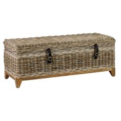 a large wicker trunk with two handles