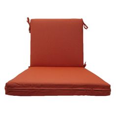 an orange outdoor chair cushion with ties on the back and seat pad, facing forward