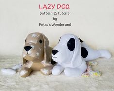 two stuffed dogs sitting next to each other on top of a white blanket with the caption lazy dog pattern & tutorial by petra's wonderland