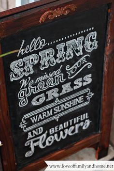 a chalkboard sign with writing on it that says, hello spring and warm for the grass and beautiful flowers