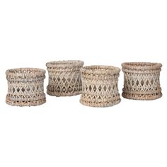 set of four woven baskets with handles