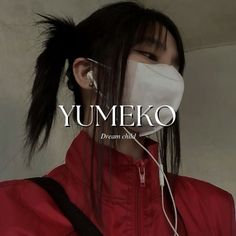 a woman wearing a face mask with the words yumeko written in front of her