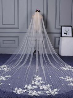 a wedding veil with flowers on it